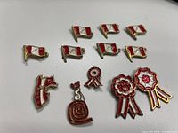 All 12 enamel lapel pins arranged on white background
