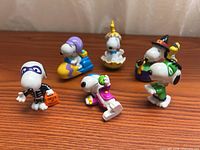 Group shot of all six Snoopy holiday PVC figures
