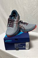 Side view of shoes on original box showing design and colorway
