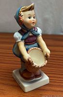 Full front view of figurine on wood surface