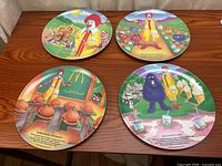 All four McDonaldland melamine plates on tabletop