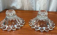 Pair of clear glass hobnail ribbed candle holders front view