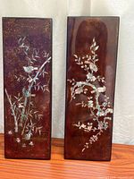 Both lacquer wall panels side by side showing full designs