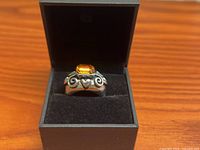 Ring in box displaying gemstone and band