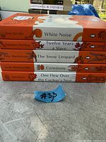 Stack showing spines of five Penguin books