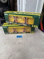 Two sealed Blitz three-pack citronella candle boxes showing front labels