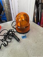 Full view of beacon showing coiled power cord and cigarette lighter plug