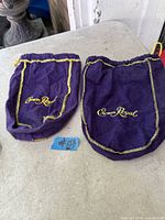 Both Crown Royal pouches laid flat showing logos and stitching