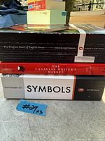 Spine view of three stacked books: The Penguin Book of English Verse, The Canadian Writer's Market, Dictionary of Symbols