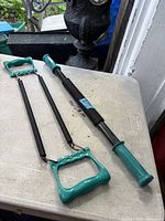 Power twister bar and hand grip exerciser on tabletop