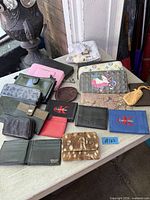 Group shot of all wallets on table