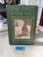 Front cover showing title, author, decorative border and photo