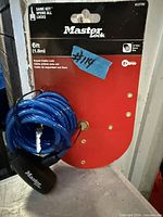 Packaged Master Lock 6ft keyed cable lock showing cable, lock head, and key