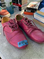 pair of pink John Fluevog men’s shoes front view