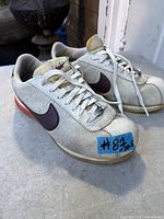 Pair of Nike Cortez sneakers front/side view