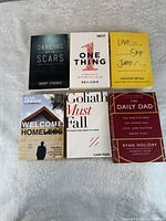 Six books laid out showing covers