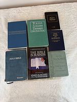 All seven books displayed front covers visible