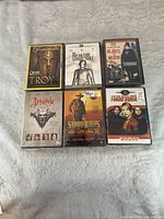 Front covers of all six sealed DVDs