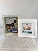 Both white keepsake frames side by side showing front view