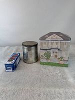 Group shot of all three tins: Sutter Home house tin, Chase & Sanborn's round canister, Oreo tin