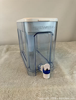 Side view of ZeroWater dispenser showing spigot and clear body