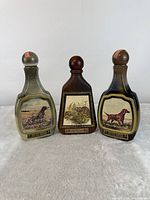 Front view of all three wildlife series decanters