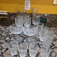 Full set of assorted glasses and bowl on countertop