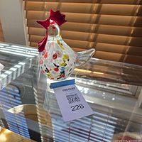 Front angled view of glass rooster figurine