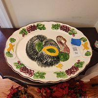 Full view of platter on table showing turkey center and fruit border