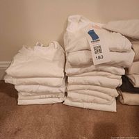 Stacked white T-shirts