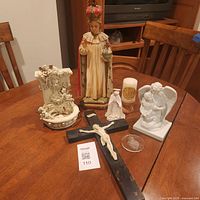 Group shot of all seven religious items on table