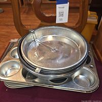 Stacked round cake pans with latch, muffin pan underneath