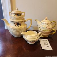 Group view of all porcelain tea service pieces