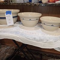 All three Roseville stoneware bowls on table