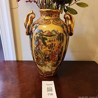 Full view of vase front showing decoration and handles