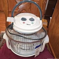 Overall view of Savoureux Pro Line halogen convection oven showing lid with controls, glass bowl, wire rack and base