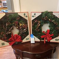 Both wreaths in original GF boxes displayed side by side
