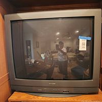 Front view of Sharp CRT TV showing screen and cabinet