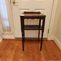 Full view of wooden side table in room