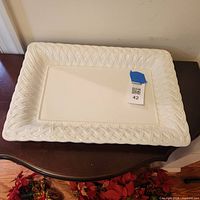 Full view of rectangular white porcelain platter on table