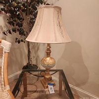 Full view of lamp showing shade, crystal accent, and base
