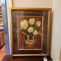 Full view of framed floral artwork in gold-tone frame