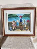 Full view of framed painting on stand