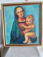 Full view of framed painting showing Madonna and Child subject