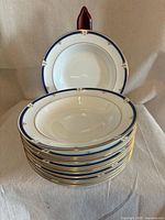 Stack of twelve Wedgwood Crestwick soup plates showing rim design