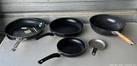 Group shot of all five pans on table