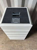 Full view of white Aspen air purifier showing stacked body and top grille