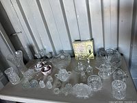 Overview of entire assortment laid on table inside metal-sided room