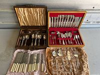 Overview of both wooden canteen boxes and loose flatware