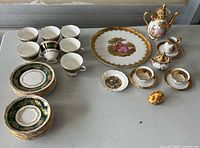 Group shot showing full assortment of tea set and decorative pieces